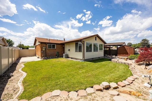 8097 S 535 E, Sandy, UT 84070 - back of property with a storage unit, a fenced backyard, and a patio area
