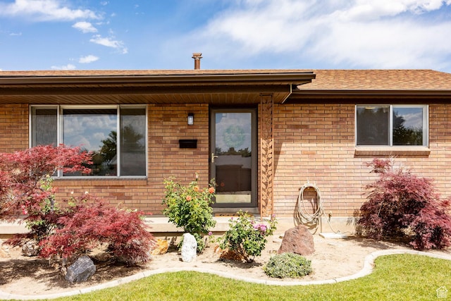 8097 S 535 E, Sandy, UT 84070 - view of front of home featuring brick siding and roof with shingles