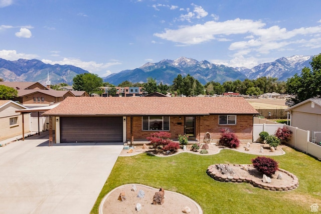 8097 S 535 E, Sandy, UT 84070 - single story home featuring an attached garage, a mountain view, brick siding, and driveway