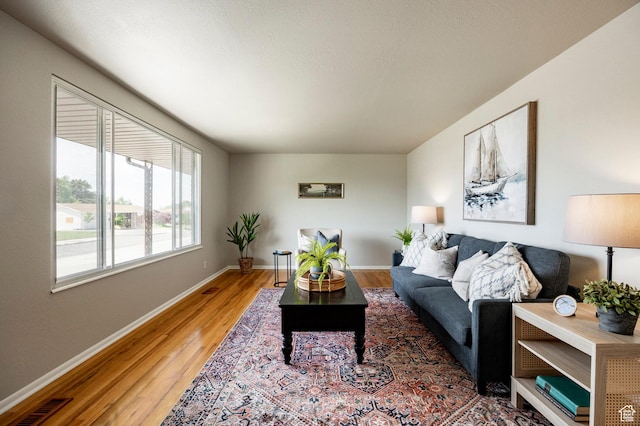 8097 S 535 E, Sandy, UT 84070 - living area featuring light wood-style flooring and baseboards