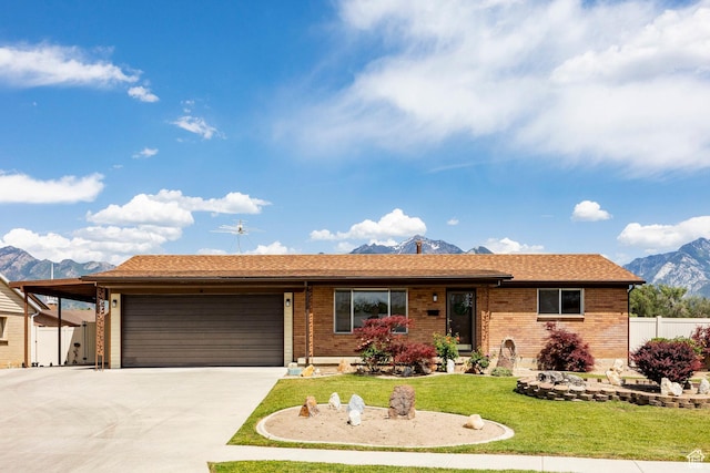 8097 S 535 E, Sandy, UT 84070 - single story home featuring a mountain view, a garage, driveway, and brick siding