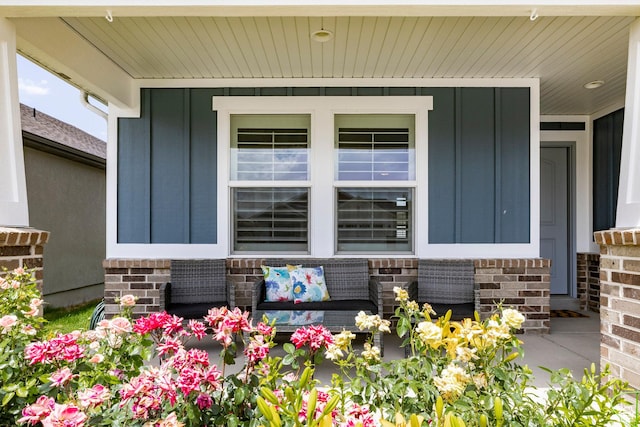 2402 W 525 S, Layton, UT 84041 - view of exterior entry with board and batten siding, covered porch, and brick siding
