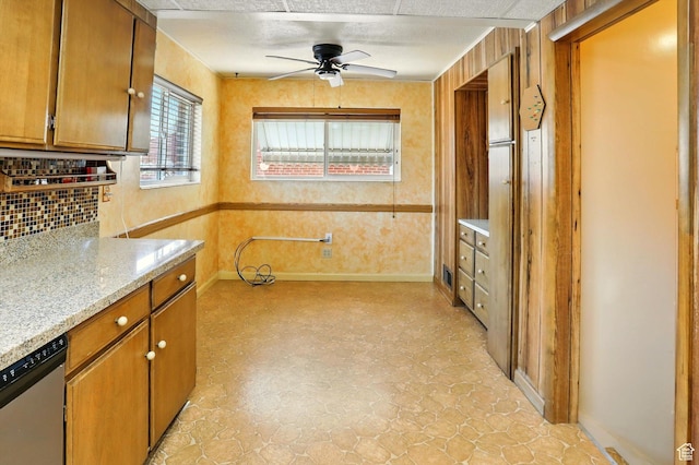 1743 N 250 W, Sunset, UT 84015 - kitchen featuring dishwasher, ceiling fan, tasteful backsplash, and brown cabinetry