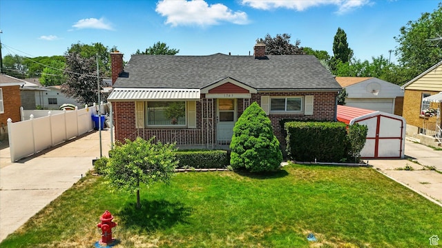 1743 N 250 W, Sunset, UT 84015 - bungalow-style home with brick siding, a chimney, a shed, and roof with shingles