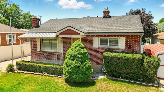1743 N 250 W, Sunset, UT 84015 - bungalow-style house featuring brick siding, a chimney, and roof with shingles