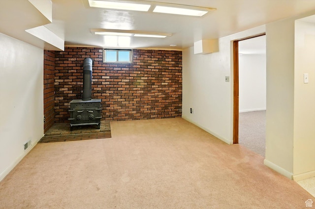 1743 N 250 W, Sunset, UT 84015 - basement with carpet, a wood stove, and brick wall