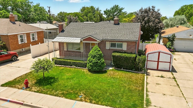 1743 N 250 W, Sunset, UT 84015 - view of front of house featuring brick siding, a chimney, roof with shingles, and driveway
