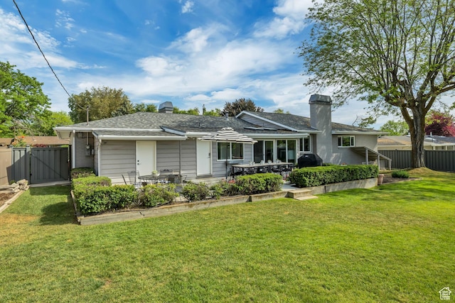 2241 E Melodie Ann Way, Holladay, UT 84124 - back of house featuring a chimney, a gate, and a patio