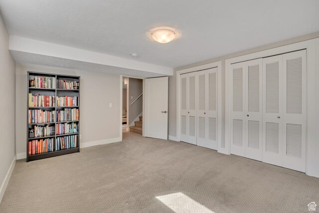2241 E Melodie Ann Way, Holladay, UT 84124 - unfurnished bedroom featuring two closets, carpet, and baseboard heating