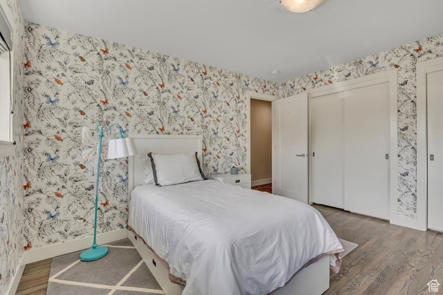 2241 E Melodie Ann Way, Holladay, UT 84124 - bedroom with wood finished floors, wallpapered walls, and a closet