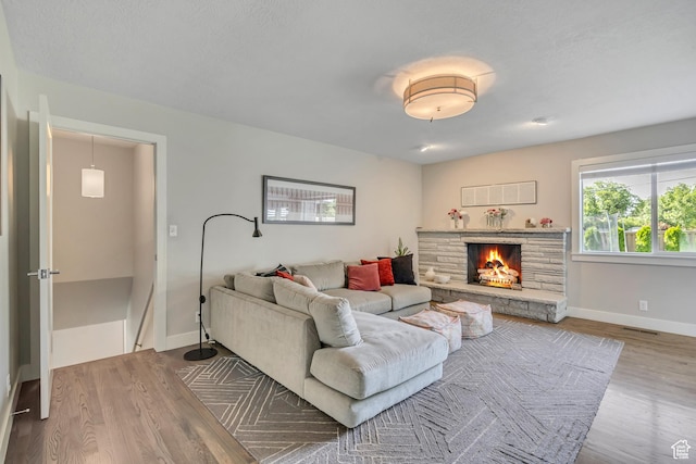 2241 E Melodie Ann Way, Holladay, UT 84124 - living area with wood finished floors and a stone fireplace