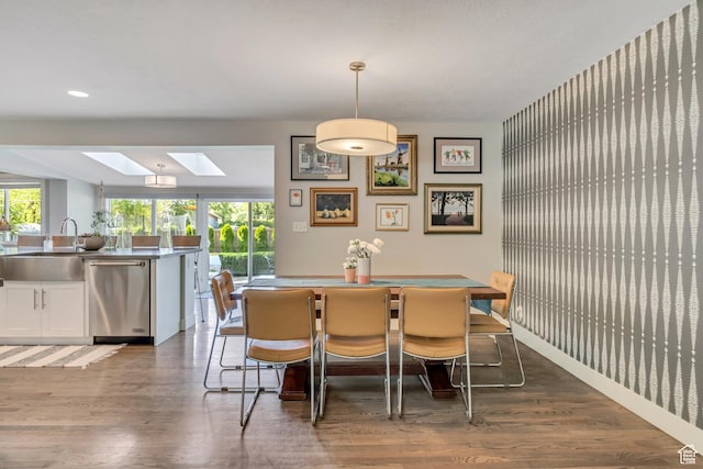 2241 E Melodie Ann Way, Holladay, UT 84124 - dining room featuring a skylight, wood finished floors, and healthy amount of natural light