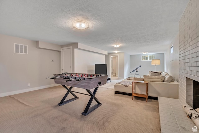 2241 E Melodie Ann Way, Holladay, UT 84124 - game room featuring light carpet, a textured ceiling, and a fireplace