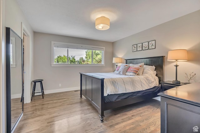 2241 E Melodie Ann Way, Holladay, UT 84124 - bedroom featuring light wood-style flooring and baseboards