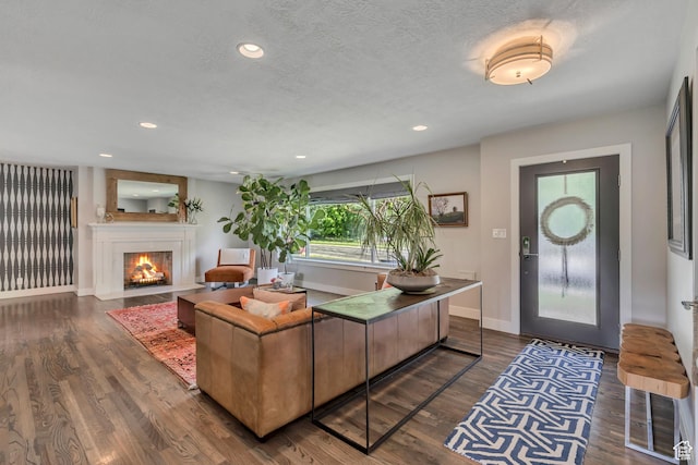 2241 E Melodie Ann Way, Holladay, UT 84124 - living room featuring dark wood-style flooring, a fireplace with flush hearth, recessed lighting, and a textured ceiling