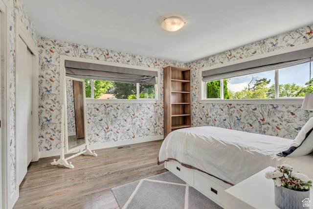 2241 E Melodie Ann Way, Holladay, UT 84124 - bedroom featuring wallpapered walls and wood finished floors