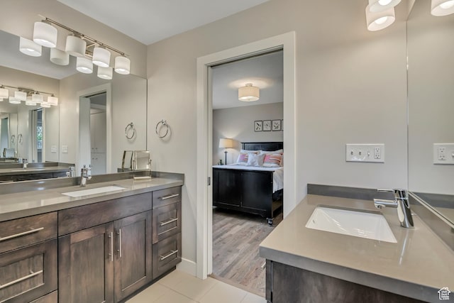 2241 E Melodie Ann Way, Holladay, UT 84124 - ensuite bathroom featuring two vanities and tile patterned flooring