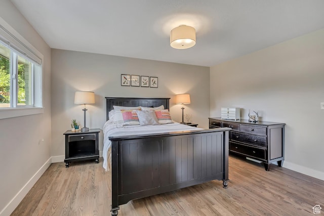 2241 E Melodie Ann Way, Holladay, UT 84124 - bedroom featuring light wood-type flooring and baseboards
