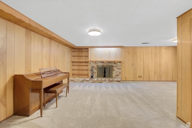 871 N 400 E, Logan, UT 84321 - living area with light carpet, wood walls, and a brick fireplace