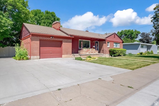 871 N 400 E, Logan, UT 84321 - ranch-style house featuring brick siding, a garage, concrete driveway, a chimney, and roof with shingles