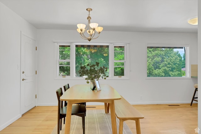 871 N 400 E, Logan, UT 84321 - dining space featuring a chandelier, light wood-style floors, and healthy amount of natural light