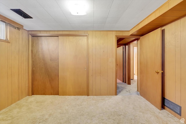 871 N 400 E, Logan, UT 84321 - unfurnished bedroom featuring carpet flooring, a closet, and wood walls