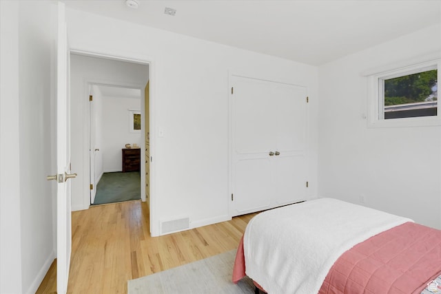 871 N 400 E, Logan, UT 84321 - bedroom featuring light wood finished floors and a closet