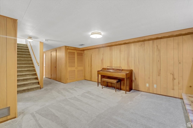 871 N 400 E, Logan, UT 84321 - finished basement featuring light carpet, stairway, and wood walls
