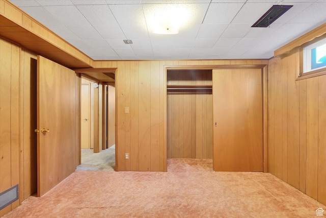 871 N 400 E, Logan, UT 84321 - unfurnished bedroom featuring carpet flooring, a closet, and wooden walls