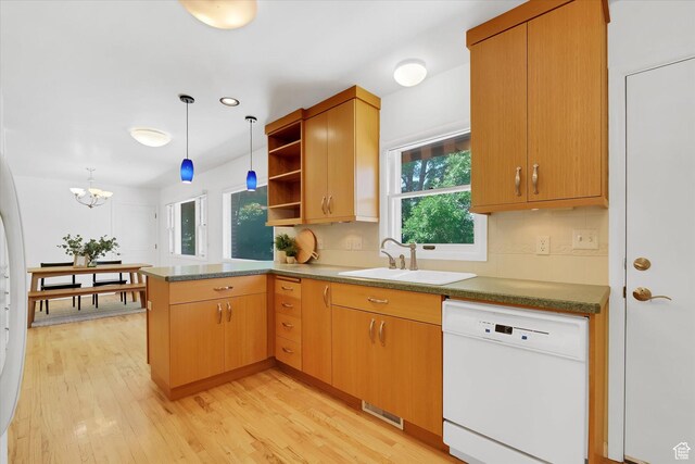 871 N 400 E, Logan, UT 84321 - kitchen featuring white dishwasher, a peninsula, open shelves, light wood-style flooring, and hanging light fixtures