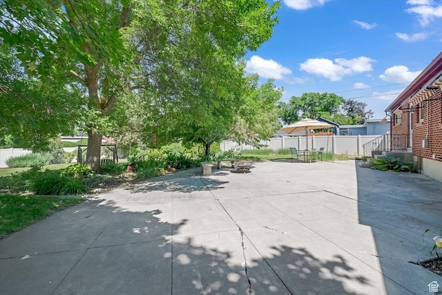 871 N 400 E, Logan, UT 84321 - fenced backyard featuring an outdoor fire pit and a patio
