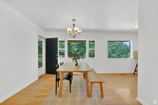 871 N 400 E, Logan, UT 84321 - dining space with light wood finished floors and a chandelier