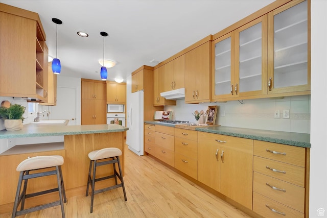 871 N 400 E, Logan, UT 84321 - kitchen featuring white appliances, light wood-style floors, under cabinet range hood, a peninsula, and open shelves