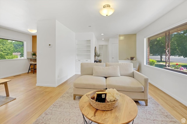 871 N 400 E, Logan, UT 84321 - living area featuring light wood-type flooring and baseboards