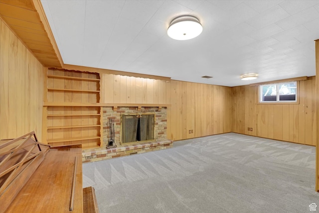 871 N 400 E, Logan, UT 84321 - unfurnished living room featuring wooden walls, carpet, and a fireplace