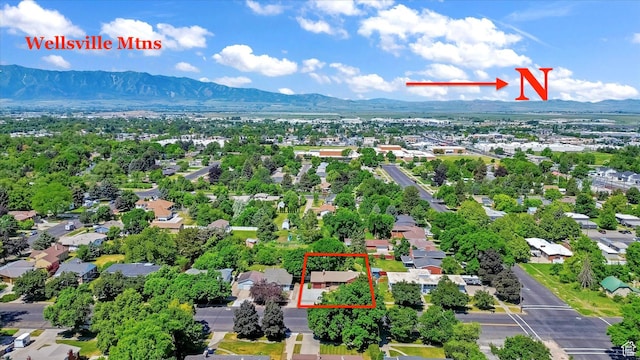 871 N 400 E, Logan, UT 84321 - aerial view of residential area with a mountain backdrop and property boundaries highlighted