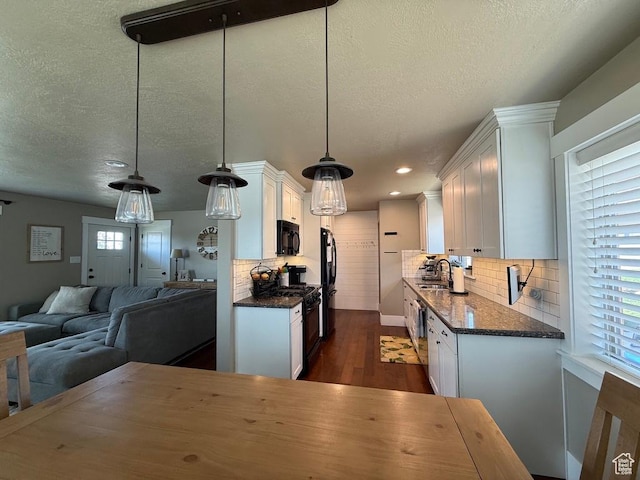 930 N 650 E, Bountiful, UT 84010 - kitchen featuring black appliances, white cabinetry, dark wood-style floors, open floor plan, and a textured ceiling
