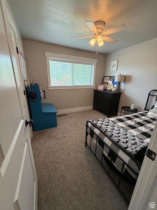 930 N 650 E, Bountiful, UT 84010 - bedroom featuring carpet flooring, a textured ceiling, and a ceiling fan
