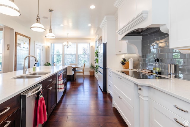 981 E Pebble Creek Rd, Smithfield, UT 84335 - kitchen featuring stainless steel dishwasher, black electric cooktop, custom exhaust hood, recessed lighting, and white cabinetry