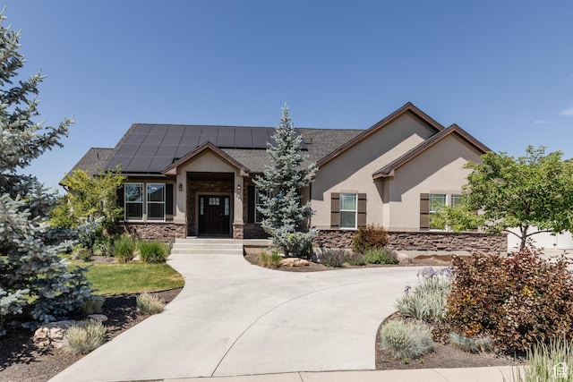 981 E Pebble Creek Rd, Smithfield, UT 84335 - view of front of house with stone siding, stucco siding, and roof mounted solar panels
