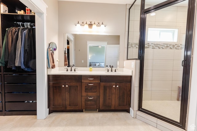 981 E Pebble Creek Rd, Smithfield, UT 84335 - full bath featuring a stall shower, double vanity, a spacious closet, and tile patterned flooring
