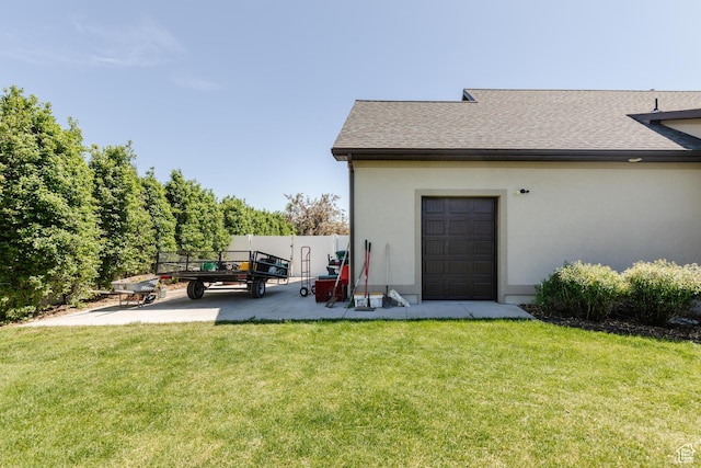 981 E Pebble Creek Rd, Smithfield, UT 84335 - rear view of house with stucco siding, roof with shingles, a patio area, and a lawn
