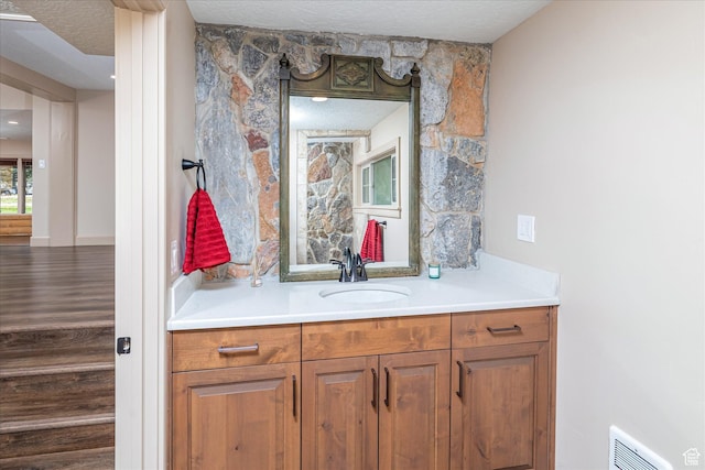 210 S 100 E, Fielding, UT 84311 - bathroom featuring vanity and a textured ceiling