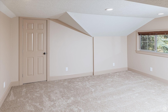 210 S 100 E, Fielding, UT 84311 - additional living space with vaulted ceiling, a textured ceiling, carpet flooring, and recessed lighting
