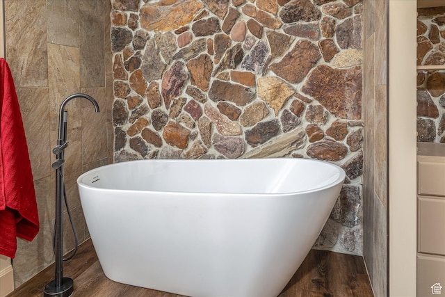 210 S 100 E, Fielding, UT 84311 - full bath featuring a soaking tub and wood finished floors