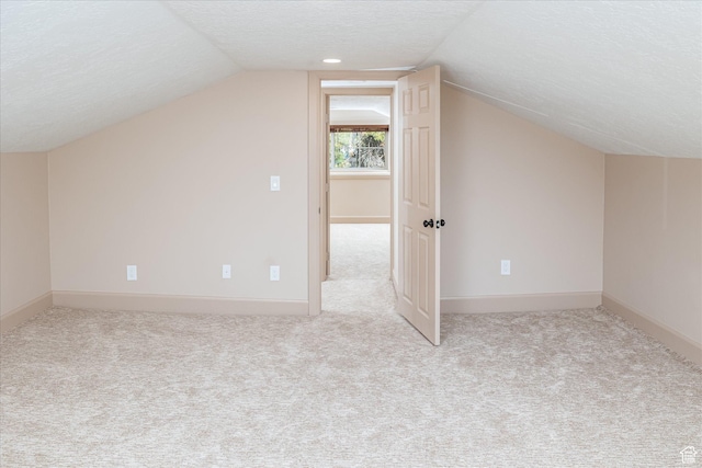 210 S 100 E, Fielding, UT 84311 - additional living space featuring carpet floors, a textured ceiling, and vaulted ceiling