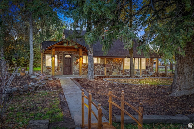 210 S 100 E, Fielding, UT 84311 - rustic home with stone siding and roof with shingles