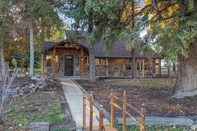 210 S 100 E, Fielding, UT 84311 - view of front of house featuring stone siding and roof with shingles