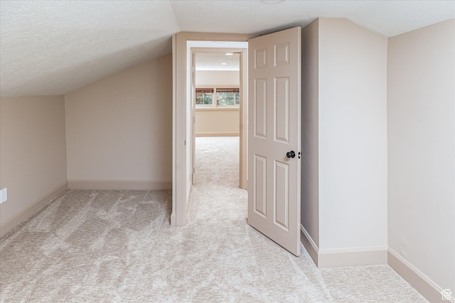 210 S 100 E, Fielding, UT 84311 - additional living space with carpet flooring, a textured ceiling, and lofted ceiling