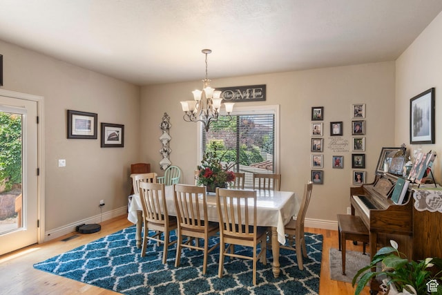 258 E Red Leaf Dr, Draper, UT 84020 - dining room with a chandelier and wood finished floors